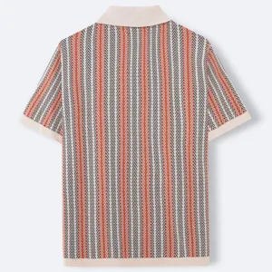 Back view detail of a men's knit polo shirt with orange and black zigzag stripes.