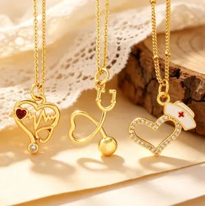 Gold-plated medical theme necklace featuring cute stethoscope and nurse hat pendants.