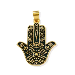 Detailed shot of green enamel hamsa hand brass pendant showcasing intricate golden lines.