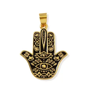 Gold plated hamsa hand pendant detail shot, black enamel evil eye charm for DIY jewelry making