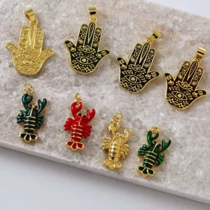 Brass 18K gold enamel Hamsa hand lobster charm detail shot for DIY jewelry making.