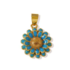 Detailed view of the gold-plated sunflower flower pendant charm with vibrant blue enamel.