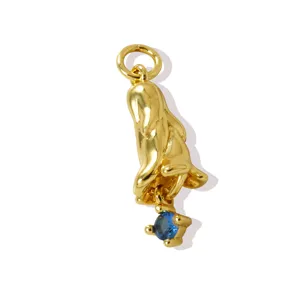 Exquisite 18K gold-plated brass flower pendant featuring a sparkling blue zircon gemstone.
