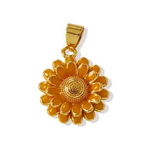 Detailed close-up of a gold-plated copper sunflower pendant with vibrant yellow enamel finish.