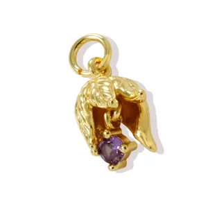 Detailed view of the 18k gold plated brass flower pendant with purple cubic zirconia.