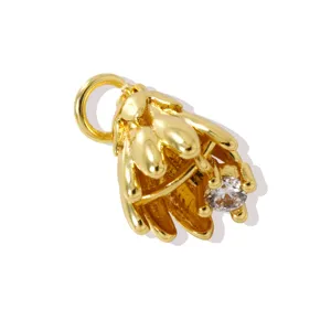 Gold brass flower pendant detail view with clear zircon inlay, ideal for DIY jewelry.