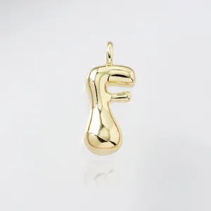 Gold puffy letter F pendant detail shot, glossy metal finish for necklace jewelry making.