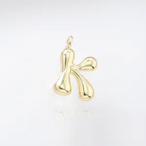 Gold puffy letter K pendant detail view, cute bubble alphabet charm for DIY jewelry making.