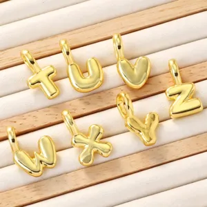 Gold plated alphabet letter charms for DIY jewelry making, stylish brass initial pendants.