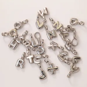 Silver metal 26 English letter charms pendants DIY jewelry necklace bracelet making detail view.