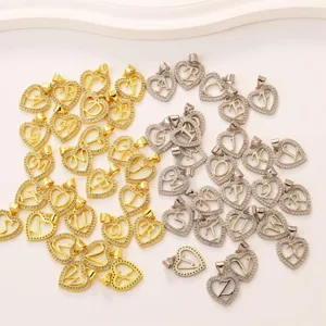 Gold and silver tone rhinestone heart initial letter charms for DIY jewelry making.