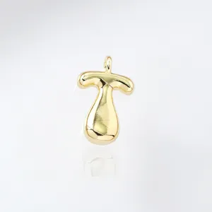 Close-up shot of a glossy gold-plated puffy bubble letter pendant, elegant and modern style.