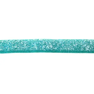 Turquoise glitter velvet ribbon close up detail, shiny flocked craft ribbon trim.