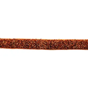 Sparkly metallic velvet ribbon close-up, shiny glitter craft trim for DIY hair bows accessories.