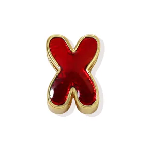 Gold plated copper red enamel letter X pendant detail, fashion dopamine jewelry accessory.