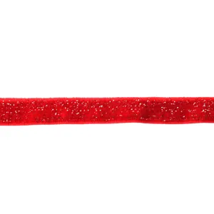 Close-up of red glitter velvet ribbon with metallic threads, perfect for DIY hair crafts.