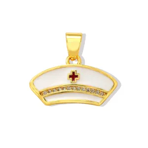 Gold plated nurse cap pendant with white enamel red cross and clear crystals for DIY jewelry.