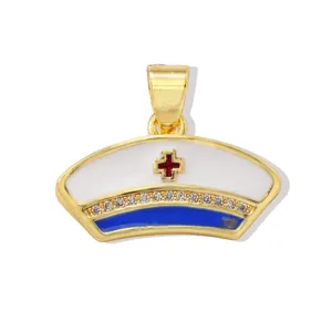 Gold nurse cap pendant with blue white enamel red cross and sparkling rhinestones for DIY jewelry.