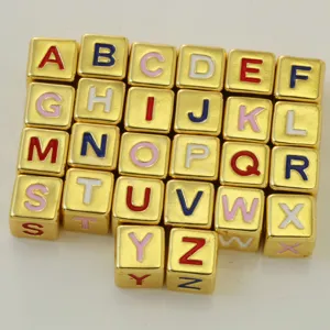 Gold square alphabet beads detail view, perfect for DIY name necklaces and custom charm bracelets.