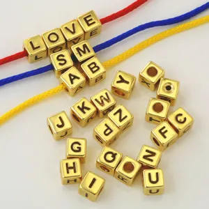 Gold square letter beads DIY charm bracelet necklace making set with colorful strings detail view.