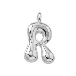Close-up detail of a shiny 3D puffy bubble letter R silver pendant jewelry accessory.