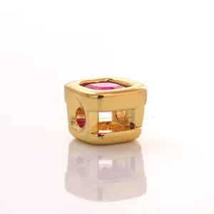 Close-up detail of geometric square brass cubic zirconia birthstone DIY charm bead part.