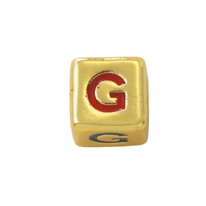 Gold square letter charm bead with red enamel G, perfect for DIY jewelry and custom necklaces.