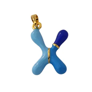 Detailed close-up of the blue enamel letter X pendant, crafted with gold-plated brass hardware.