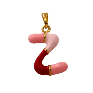 Detailed view of the colorful enamel letter pendant showcasing vibrant pink and red segments.