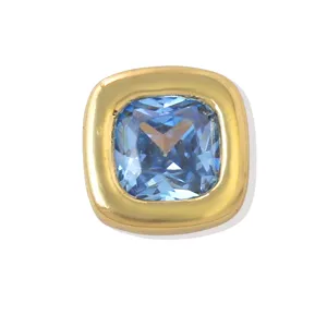 Close-up detail of a square blue zircon set in chunky gold-plated brass DIY bead.