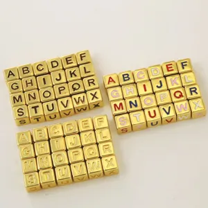 Detail view of square gold alphabet beads, perfect for DIY name necklaces and bracelets making.