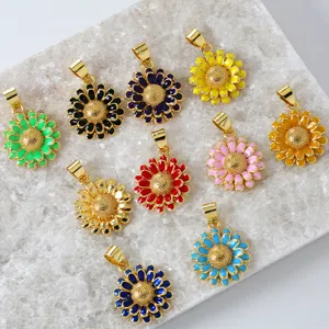 Detailed view of colorful enamel sunflower pendants, gold plated copper charm jewelry.