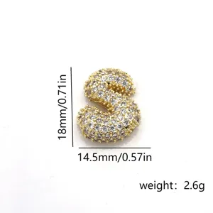 Bubble letter S zircon pendant close-up, copper micro-pave cubic zirconia jewelry detail shot.