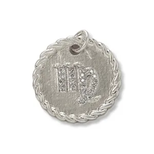 Detailed close-up view of the copper micro-paved cubic zirconia Virgo zodiac pendant.