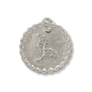 Close-up of the exquisite rhinestone paved zodiac pendant showing fine metal texture details.