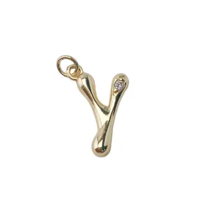 Close-up detail of gold-plated letter Y pendant with crystal inlay for DIY necklace jewelry.