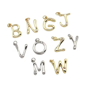 Gold and silver alphabet letter pendants, brass DIY necklace charms with sparkling stones.