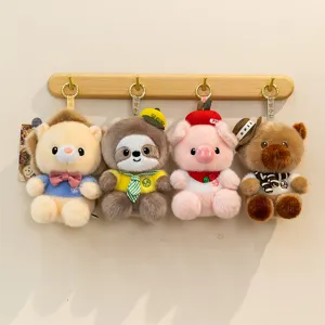 Cute plush animal keychain set featuring four adorable cartoon dolls hanging on a wooden hook rack.