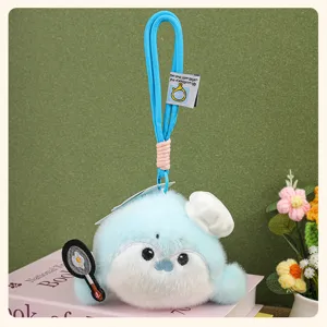 Cute blue plush otter keychain with chef hat holding a frying pan, soft toy bag charm gift.