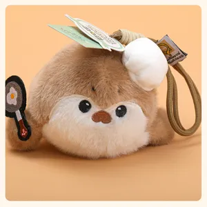 Cute sea otter plush pendant toy detail showing cute chef hat and small frying pan design.