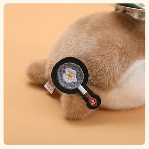 Cute plush sea otter pendant plushie doll with frying pan patch, soft bag charm gift toy.