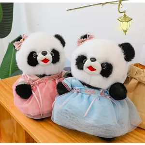 Cute panda plush toys wearing traditional Hanfu dresses, detailed close-up shot on table.