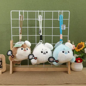 Cute otter plush keychain with chef hat and frying pan, soft bag charm toy for girls gift.