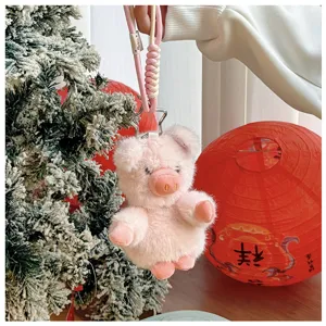 Dettaglio portachiavi maialino in peluche, grazioso ciondolo rosa soffice per borsa.