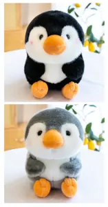 Close-up details of the cute round plush penguin stuffed animal, soft texture and sweet face.