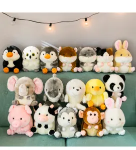 Cute cartoon animal plush toys detail view showing various spherical dolls like pandas and elephants.