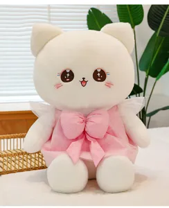 Detail shot of cute white cat plush toy featuring fluffy texture and sweet pink dress.