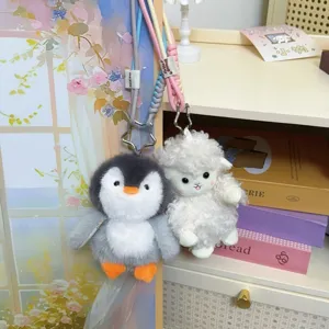 Cute cartoon plush penguin and sheep keychains with colorful braided lanyards for backpacks.