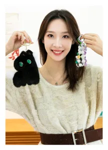 Detailed view of cute plush animal keychain and colorful beaded pendant charm for bags.