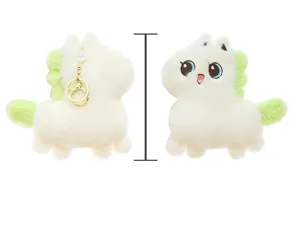 Close-up details of the cute white plush pony keychain with soft fluffy texture and key ring.